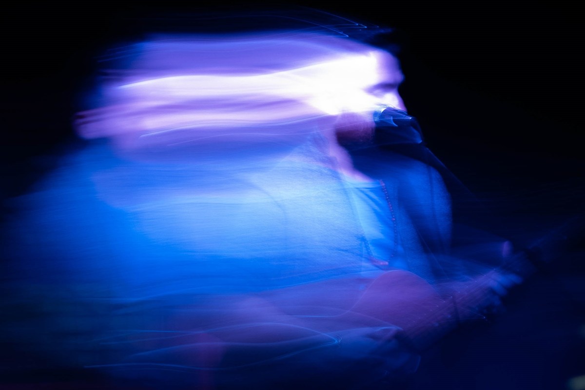 Blue motion blur photo of a man